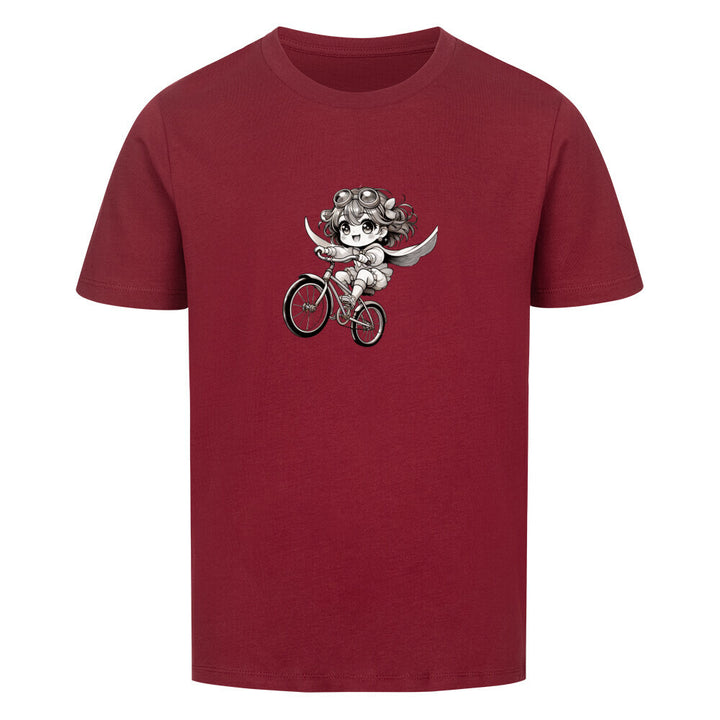 Bio-Kinder-T-Shirt mit einem süßen Manga-Mädchen, das mit Flügeln und Goggles auf einem fliegenden Fahrrad durch die Luft saust – nachhaltig & aus 100 % Bio-Baumwolle.